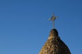 Metal cross on a stone steeple Royalty Free Stock Photo