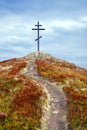 Metal cross on top of the mountain Royalty Free Stock Photo