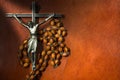 Metal Crucifix with Wooden Rosary Beads Royalty Free Stock Photo