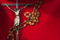 Metal Crucifix with Wooden Rosary Beads Royalty Free Stock Photo