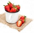 Metal cup with strawberries Royalty Free Stock Photo