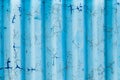 Metal curly sheets are painted in sky-blue color, old cracked paint. Abstract grunge texture. Vintage background Royalty Free Stock Photo