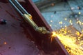 Metal Cutting With Acetylene Gas. Workman is working by use torch