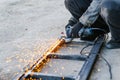 Metal cutting with an electric circular saw. Sparks fly in different directions. Blurred focus Royalty Free Stock Photo