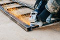 Metal cutting with an electric circular saw. Sparks fly in different directions. Blurred focus Royalty Free Stock Photo