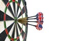 Metal darts have hit the red bullseye on a dart board. Darts Game. Darts arrow in the target center darts in bull`s eye close up. Royalty Free Stock Photo