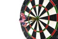 Metal darts have hit the red bullseye on a dart board. Darts Game. Darts arrow in the target center darts in bull`s eye close up i Royalty Free Stock Photo
