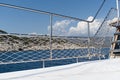 Metal deck railing with rope safety mesh on sea sailboat