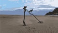 Metal Detector With A Shovel On The Seashore. Low tide. Sandy beach Royalty Free Stock Photo