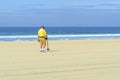 Metal detectorist on Pacific Beach Royalty Free Stock Photo