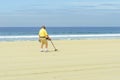 Metal detectorist on Pacific Beach Royalty Free Stock Photo
