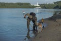 Treasure hunter is looking for a metal detector in the river Royalty Free Stock Photo