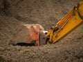 Metal digger bucket on the ground. Construction work in progress, Heavy industry machinery concept