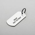 Metal dog tag engraved with \