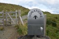 Metal donations box at Lealt Falls, Isle of Skye, Scotland