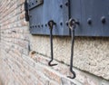 Metal Door gate Hook details with brick wall
