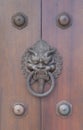 Metal door handle and brown wood door Royalty Free Stock Photo