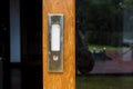 Metal door handle and brown wood door Royalty Free Stock Photo