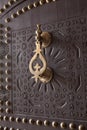 Metal doorknocker on wooden door