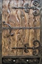 Metal doors with wooden boards and forged elements Royalty Free Stock Photo