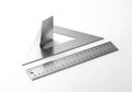 Metal drafting tools a triangle ruler and a metal ruler Royalty Free Stock Photo