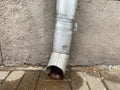 Metal drainpipe on the wall of a building Royalty Free Stock Photo
