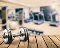 Metal dumbbell with gym background