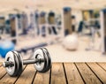 Metal dumbbell with gym background