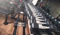 Metal dumbbells for strength training in gym