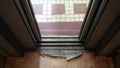 The metal elevator doors close automatically. Badly worn interior of an elevator