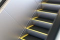 Metal escalator in modern office or public building, shopping mall, airport, railway or metro subway station
