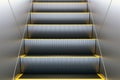 Metal escalator in modern office or public building, shopping mall, airport, railway or metro subway station Royalty Free Stock Photo