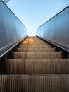 Metal escalator outdoors with blue sky Royalty Free Stock Photo