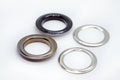 Metal eyelets with reverse ring, dark nickel and black lacquered.