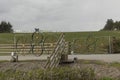 Metal farm gate made of cart wheels Royalty Free Stock Photo