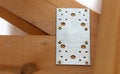 Metal fasteners on wooden boards