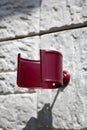 Metal fastening for a drainage pipe on a light wall of a private house. Close-up