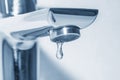 Metal faucet with falling water drop close up Royalty Free Stock Photo