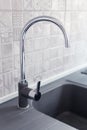 Metal faucet sink in modern kitchen. New home interior Royalty Free Stock Photo