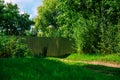 Metal fence in the countryside among green grass and blue sky Royalty Free Stock Photo