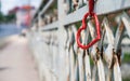 metal fence hanging red heart lock Royalty Free Stock Photo