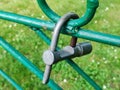 Metal fence with old padlock. Lock green fence concept