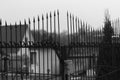 Metal fence with sharp peaks in black and white Royalty Free Stock Photo