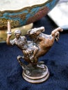 Metal figurine of a Greek warrior on a horse at a flea market in Tbilisi