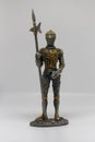 A metal figurine of a medieval armored knight, Isolated