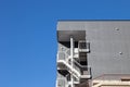 Metal fire escape outside apartment building for emergency. Royalty Free Stock Photo