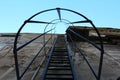 Metal fire escape stairs with round safety tunnel