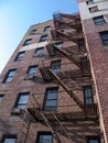 Fire Escape and Brick Building with blue sky