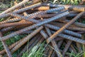 Metal fittings for reinforced concrete. Main construction materials. Background and rusty iron reinforcement rods. Red Royalty Free Stock Photo