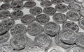 Metal five-hryvnia coins lying on a white surface. Ukrainian money